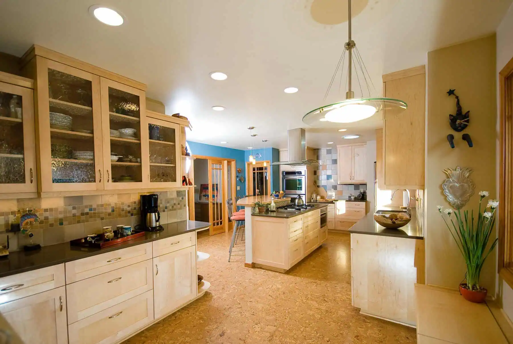 Modern kitchen with light wood cabinets