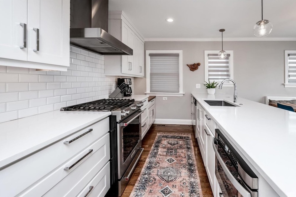 Modern kitchen with white cabinetry.